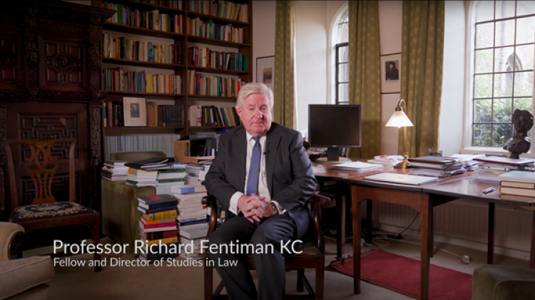 Richard Fentiman sat in his office surrounded by books