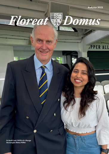 An older man and a young woman smiling for the camera at Lord's cricket ground