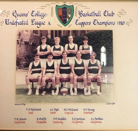 the 1995 Cuppers Basketball team photographed with a small teacup and saucer in place of a trophy