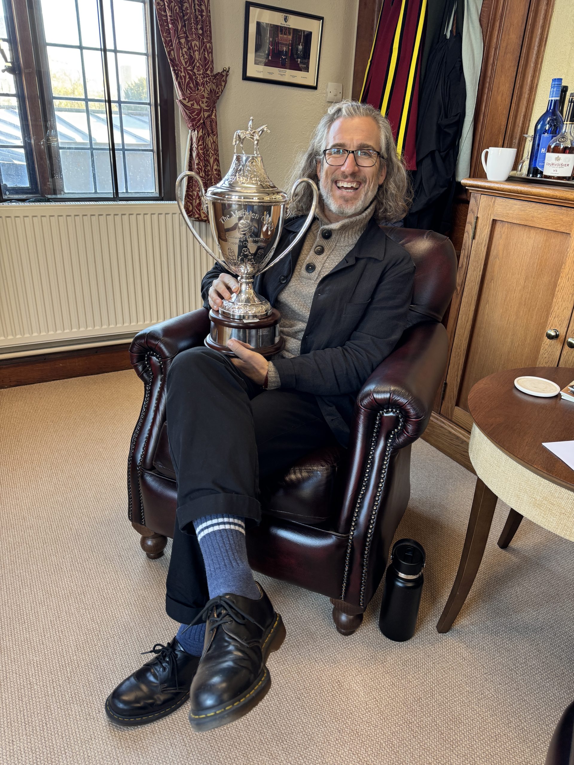 Tyler Denmead holding the Madden Cup